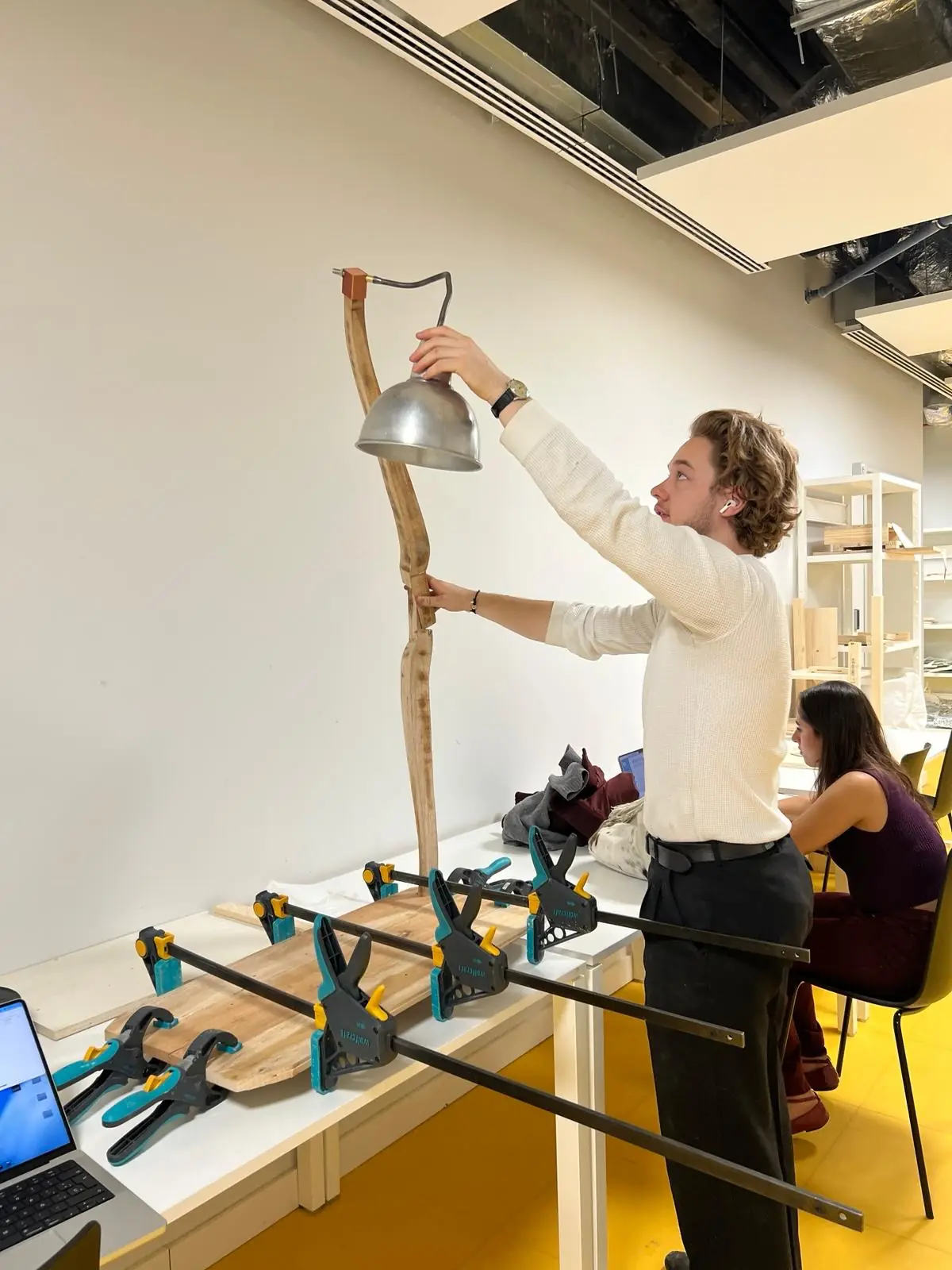 Salvaged curved timber, a bored four-centimetre section against a ruler, the 3D-printed base seating the stem, and assembly